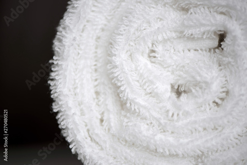 White delicate soft background of clean white close up towel rolled blanket textile texture