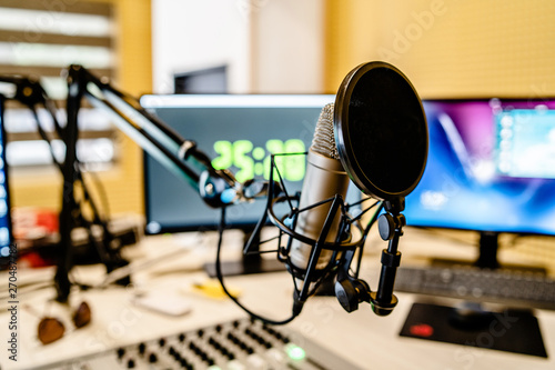 Microphone and mixer at the radio station studio broadcasting news