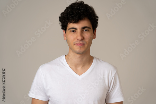 Portrait of handsome young man in neutral poker facial expressions and human emotions