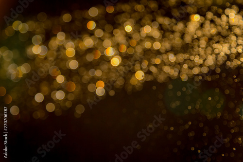 Gold blur bokeh defocused on black