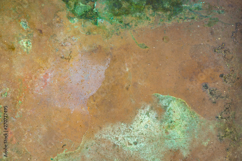 Grunge texture of verdigris oxidized on the surface of copper or brass as a background