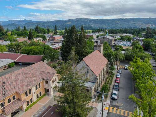 Aerial view of St. Helena Roman Catholic Church, historic church building in St. Helena, Napa Valley, California, USA. Built from 1889 to 1890, the church was constructed with stone, a common building