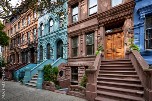 a view of a row of historic brownstones in an iconic neighborhood of Manhattan, New York City