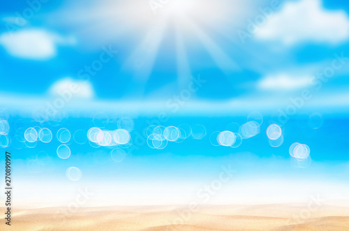 Blur tropical beach with bokeh sun light wave abstract background.