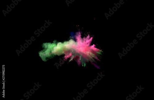 Fantastic forms of powder paint and flour combined together explode in front of a black background to give off fantastic color explosions in bizarre multi colored cloud forms.