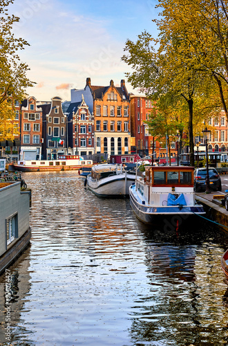 Amsterdam Netherlands dancing houses over river Amstel landmark in old european city spring landscape.