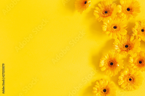 Flowers composition. Yellow gerbera flowers on yellow background. Summer concept. Flat lay, top view, copy space