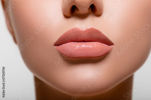 Beautiful lips macro. Beauty. mouth. makeup. Closeup Model Peach Color in Studio. - image. 