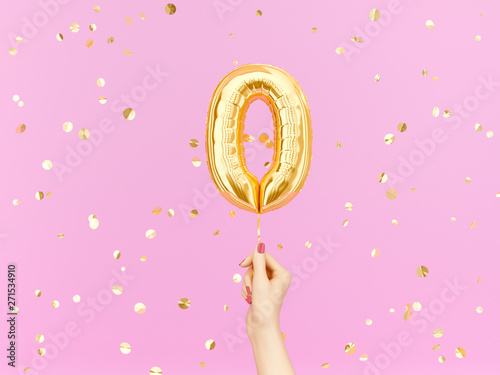 Zero on pink. Female hand holding Number 0 foil balloon. 3d rendering