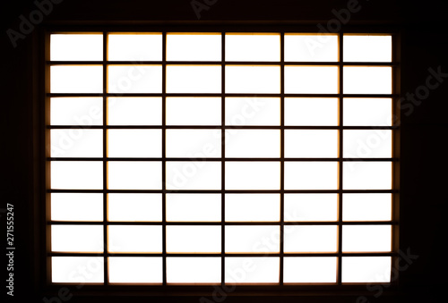 Lights shining into the room from the shoji screen window. Japanese architecture for door or window for room divider.