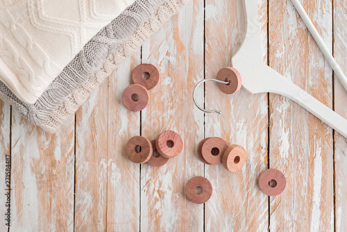 Wooden round cedar rings for hangers for moth protection.