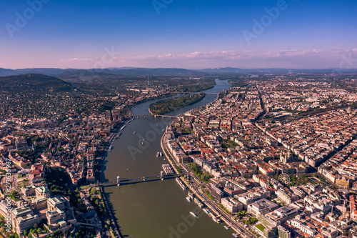 Beautiful view of the old city of Budapest from a height, shot on a drone. In the middle of the Danube river and hain bridge. Panarama with old bilding. 