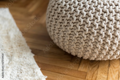 knitted tabouret pillow in room.