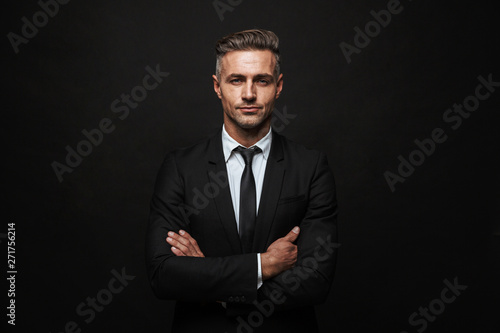 Handsome confident businessman wearing suit