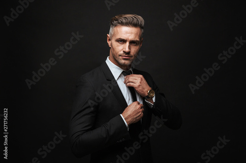 Handsome confident businessman wearing suit