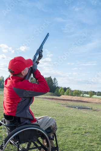 disabled person shoots skeet with a shotgun