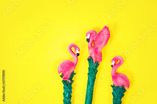 flamingo on vibrant yellow background top view
