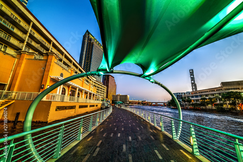 Green shelter by Tampa Riverwalk at sunset