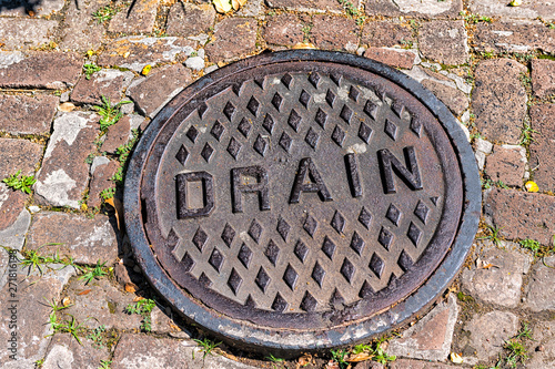 New Orleans, USA Garden district street in Louisiana famous city with drain hole on sidewalk pavement road