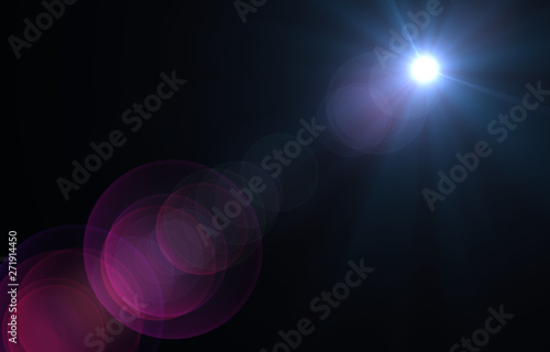 Lens flare light over black background.
