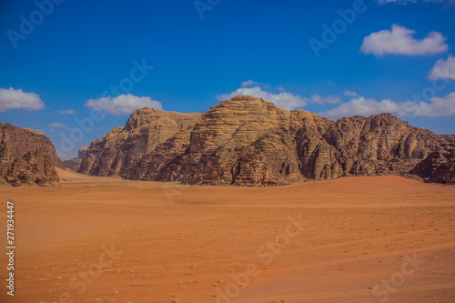 picturesque panorama photography of beautiful Wadi Rum desert scenery landscape in Middle East Jordan country with sand valley and mountain ridge background, travel destination place for tour