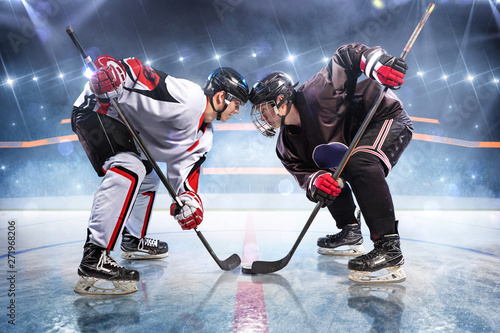 Hockey players starts game around ice arena 