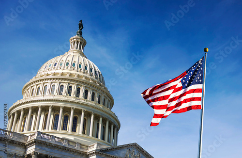 American flag waving with the Capitol Hill