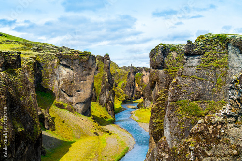 Iceland canyon fjaðrárgljúfur with river flowing through it