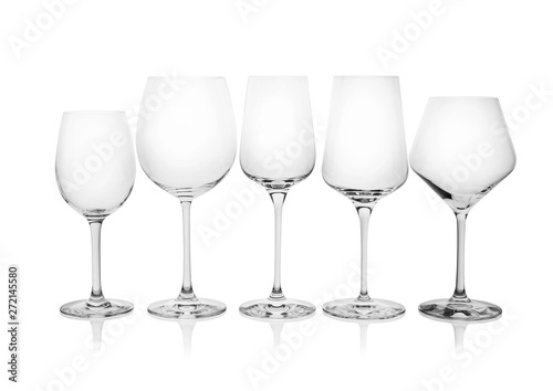 Different empty wine glasses on white background