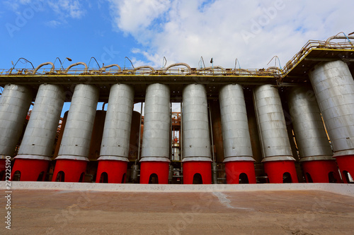 Storage tanks and pipes at alumina processing plant 