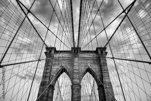 Brooklyn Bridge New York City close up architectural detail in timeless black and white under soft overcast skies