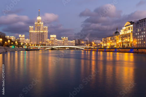 Moskva river night view with historical buildings and cloudy sky