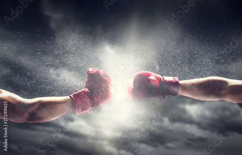 Two boxing gloves punch. Box and fight