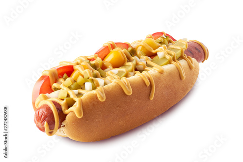 Hot dog with pickles and tomatoes on white