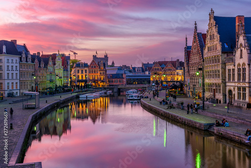 View of Graslei, Korenlei quays and Leie river in the historic city center in Ghent (Gent), Belgium. Architecture and landmark of Ghent. Sunset cityscape of Ghent.