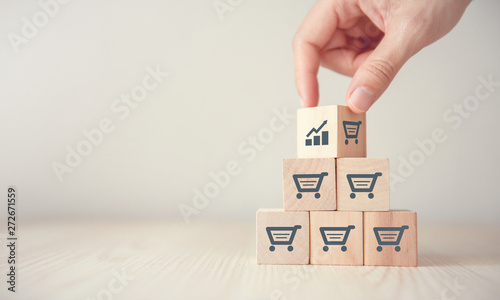 sale volume increase make business grow, Flips cube with icon graph and shopping cart symbol.