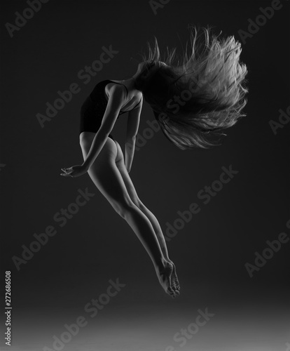 Ballerina with long hair jumping 