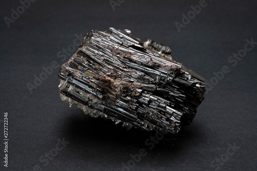 Piece of Hubnerite mineral from Pasto Bueno, Peru. A mineral consisting of manganese tungsten oxide with black monoclinic prismatic submetallic crystals with fine striations.