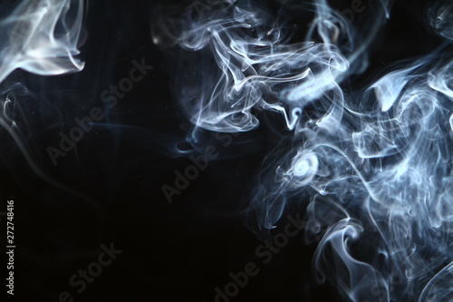 marvellous flowing contrast bright smoke against dark background.