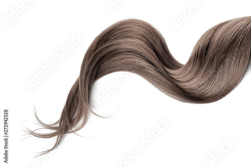 Brown hair isolated on white background. Long wavy ponytail