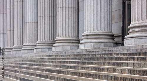 Stone pillars row and stairs detail. Classical building facade