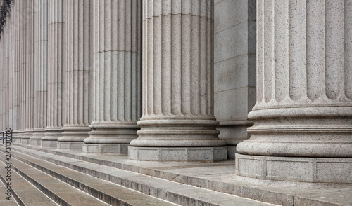 Stone pillars row and stairs detail. Classical building facade