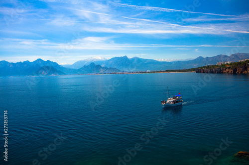 Beautiful landscape of mountains and ship in the Mediterranean sea in Turkey, Antalya.