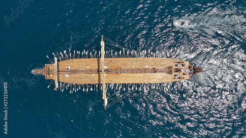 Aerial view of Athenian Trireme "OLYMPIAS", a replica of ancient warship of 5th BC century, cruising to port of Faliro, Athens Riviera, Attica, Greece