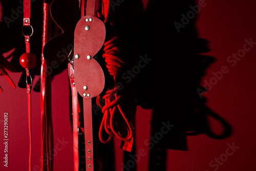 erotic games and human sexuality concept. kinky sex toys for BDSM fantasy play (ball gag, cuffs, rope, flogger, collar and leash)