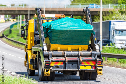 skip lorry truck on uk motorway in fast motion