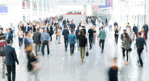 blurred people at a trade fair