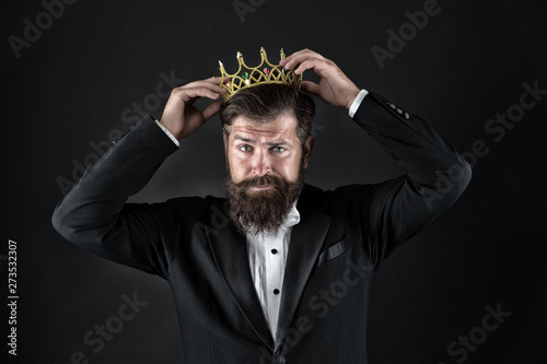 Sense of self importance. Big boss. King crown. Egoist concept. Businessman in tailored tuxedo and crown. Very important person. Important guest luxury party. Top manager. Important person award