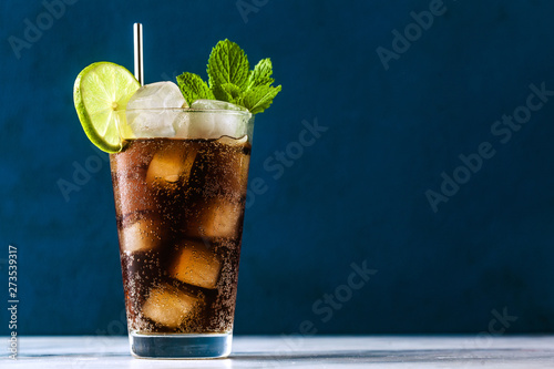 Coca Coke cocktail in a tall glass cuba libre. refreshing summer drink