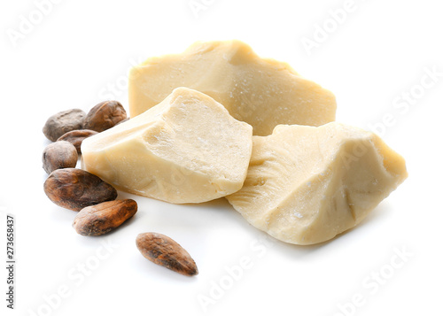 Pieces of cocoa butter on white background